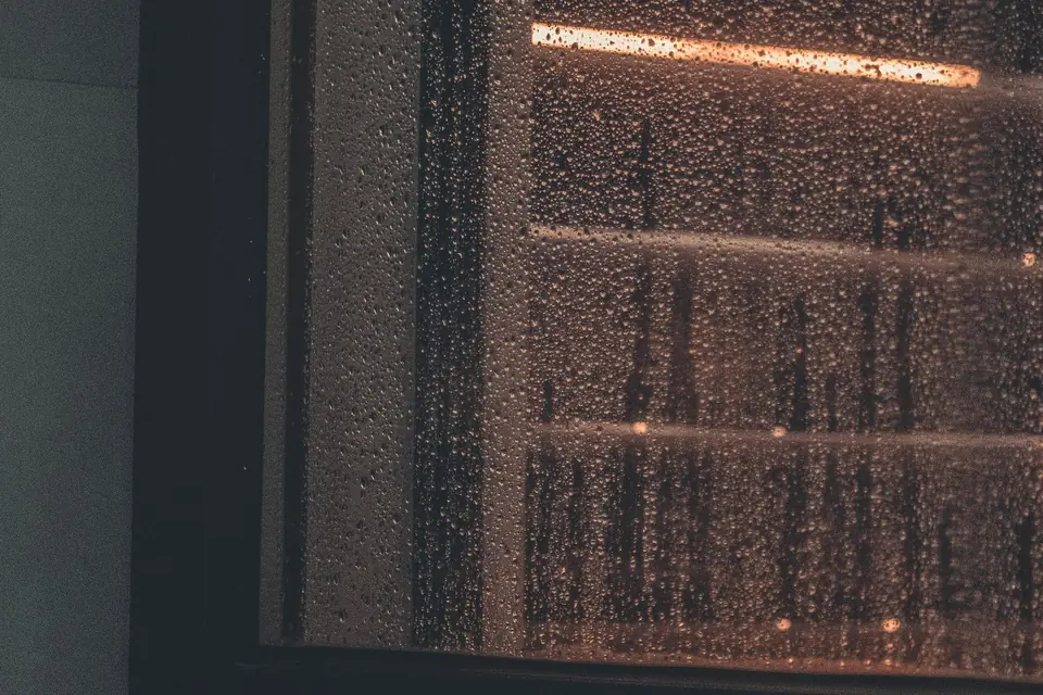 Heavy condensation running down the inside of a window in a home