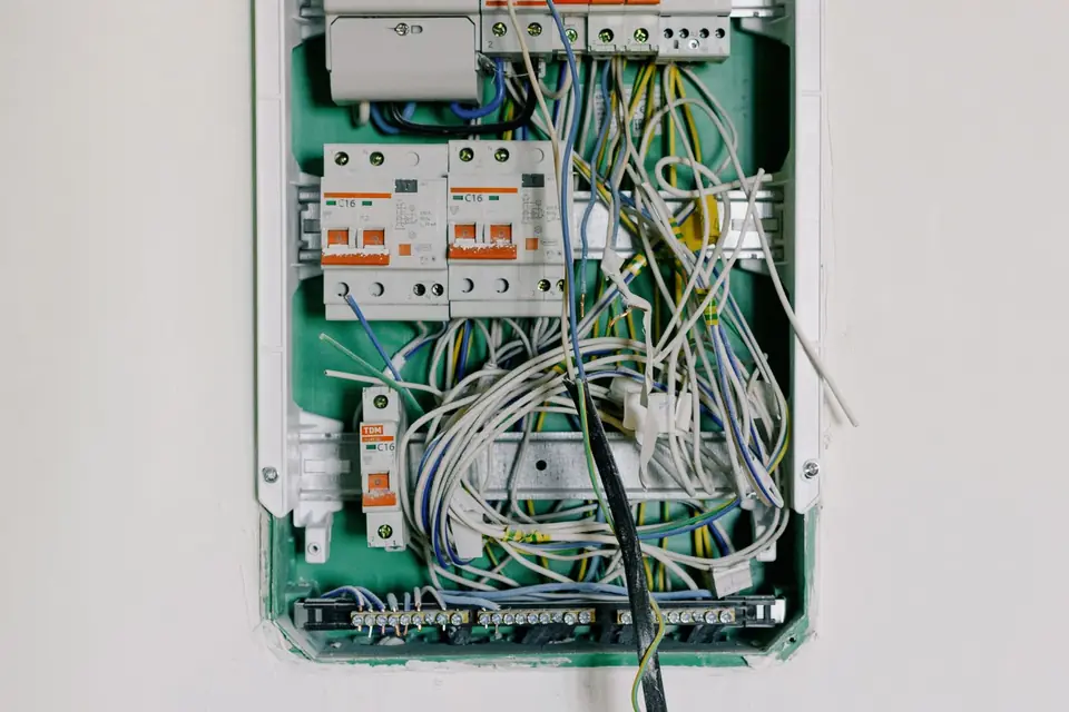 An electrician inspecting a domestic consumer unit