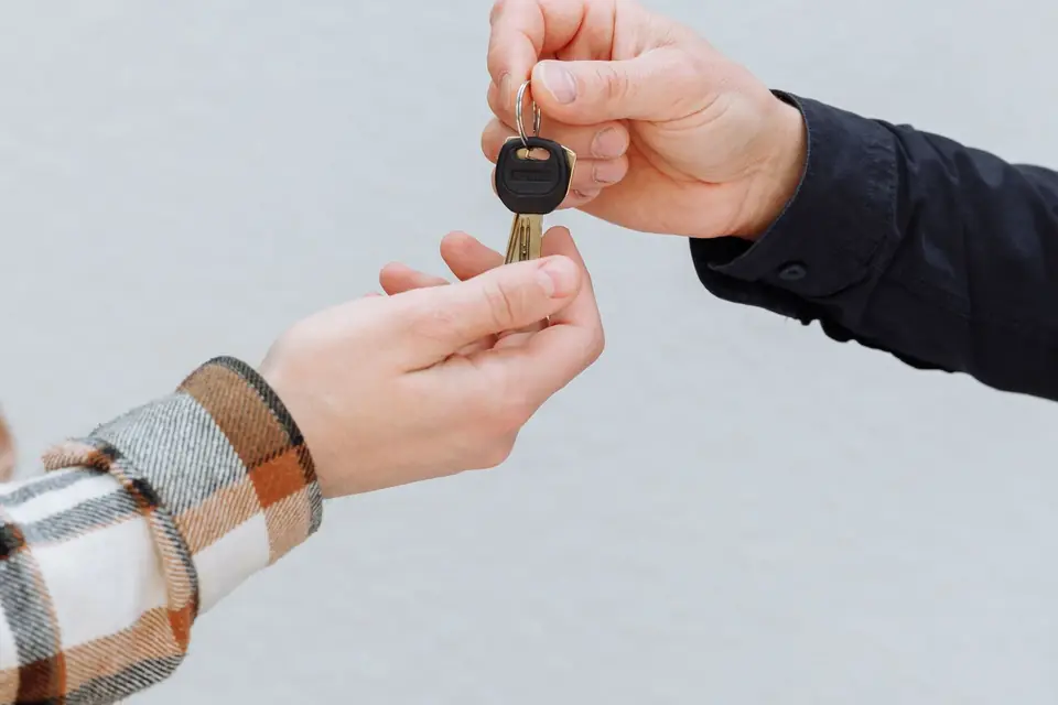 A tenant receiving the keys to a flat